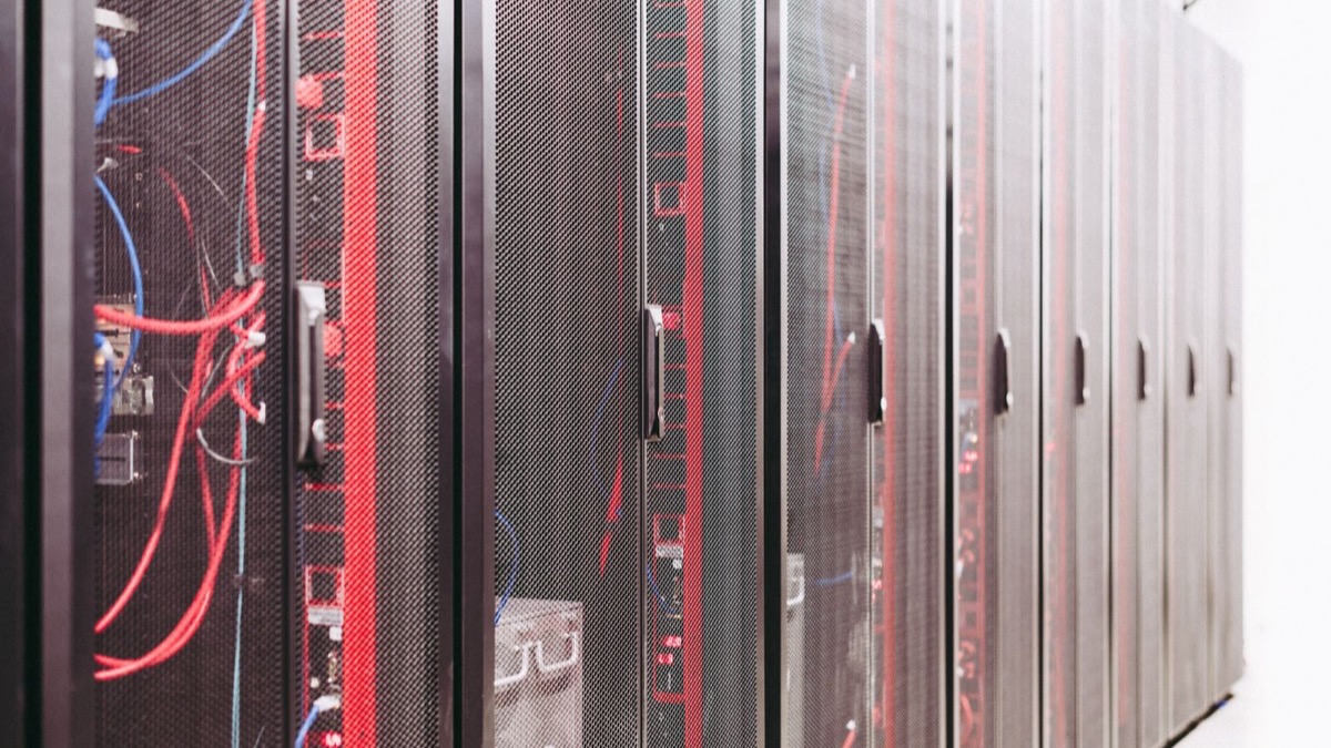 Cloud computing infrastructure with rows of server racks, illustrating provider-operated data processing