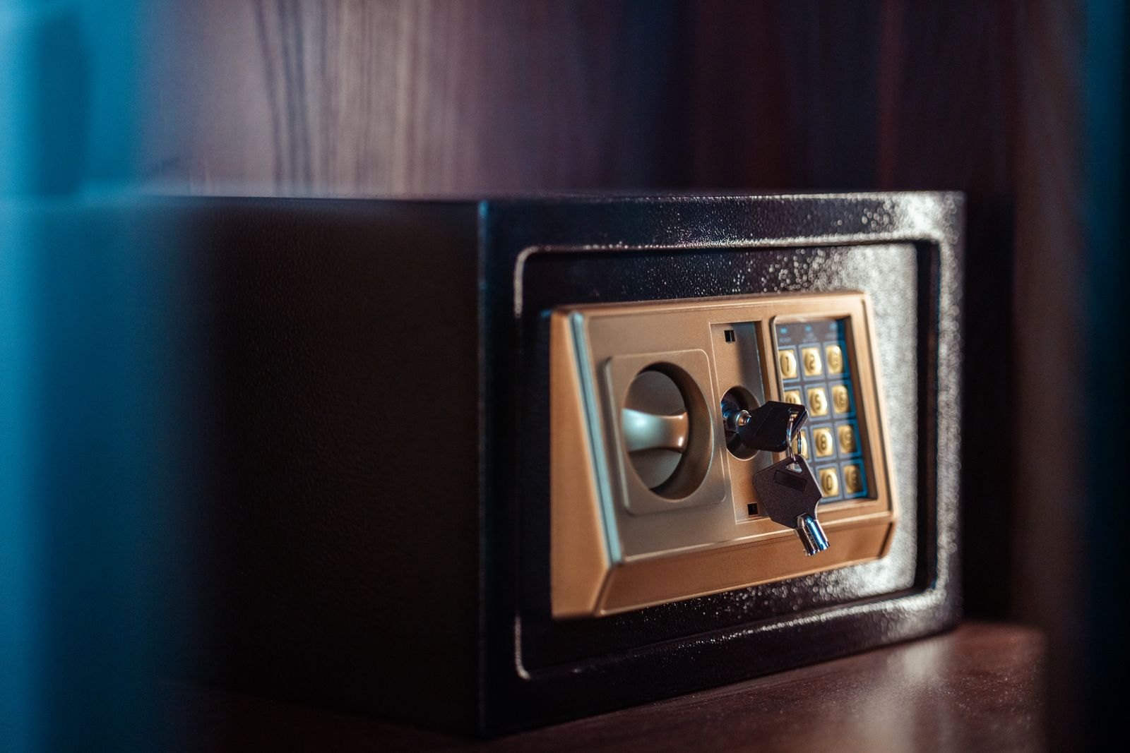 Electronic safe with key and keypad, a symbol of data kept inside the company